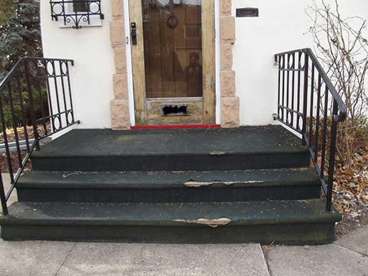 Front door and porch with wear and tear